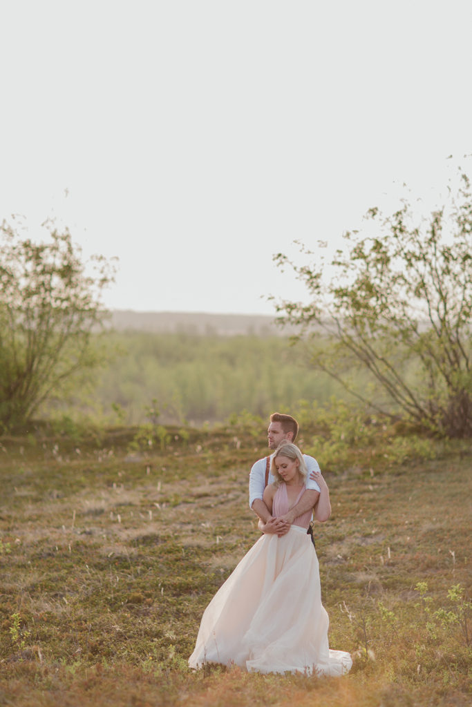 couple-embracing-inepic-landscape